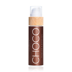 COCOSOLIS Choco suntan oil bottle close-up showing a rich, even tan