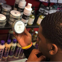 Close-up of COLDLABEL Wolfin' Pomade cap showing compact packaging