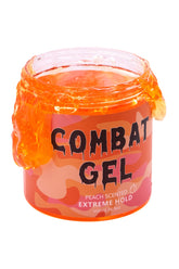 Combat Gel peach-bottle close-up highlighting the alcohol-free formula for lasting style.