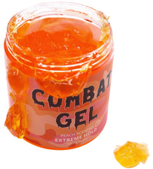 Combat Gel extreme-hold texture close-up shows peach scent for defined curls.