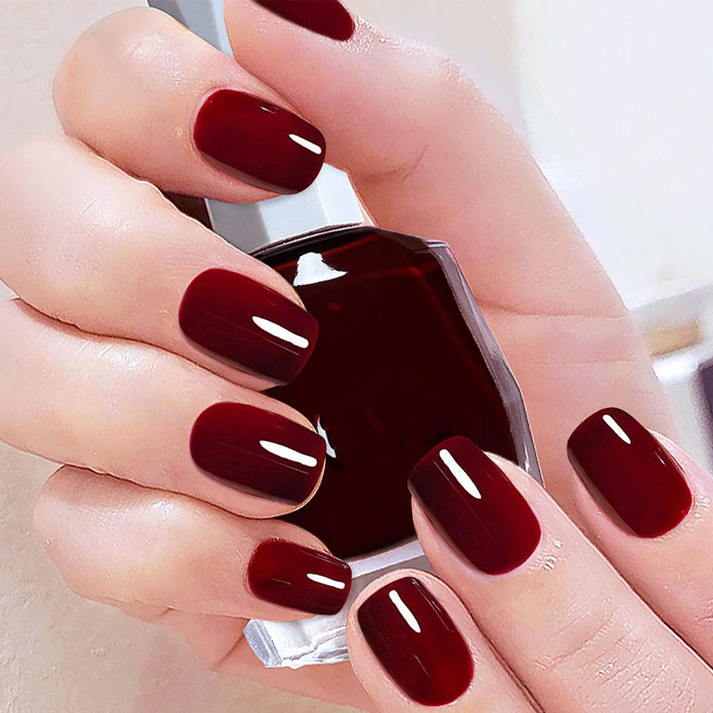 COSMOO Cherry Red Nail Polish bottle close-up showing vibrant shade for salon-ready nails.