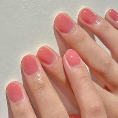 COSMOO Nude Peach Pink nail art on fingertips demonstrates versatile sheer tint.