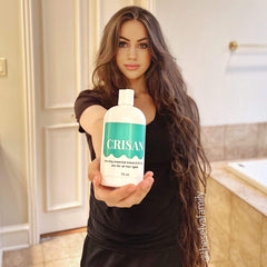 CRISAN hair oil massage application illustrating targeted scalp stimulation