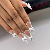 CTTHNBD long almond nails with white French tip for elegant daily wear.