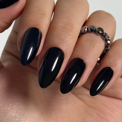 CurvLife black press-on nails with almond shape and glossy finish for salon shine.