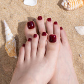 Curvlife press-on toenails with glossy French tips for a chic summer pedicure.