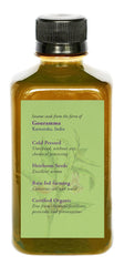DAANA sesame oil in hand for massage and moisture.