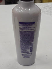 Applying the treatment to hair for smooth, manageable strands.
