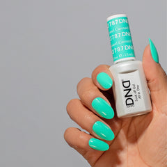 Daisy DND matching air-dry lacquer in blue complements the gel polish shade.