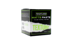 Dauntless Matte Paste cube packaging showing portable styling kit for on-the-go looks.