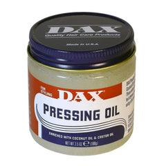 DAX Pomades Pressing Oil bottle with nourishing blend for moisture and heat protection.