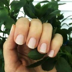 Dazzle Dry Rose Quartz nail closeup shows soft pink blush on nails.