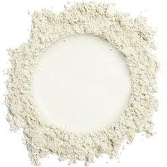 Demure Mineral Concealer tube swirl demonstrates the yellow-toned brightening formula.