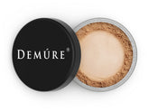 DEMÚRE Demure Mineral Finishing Powder in Tan, jar visible, helps makeup last longer while skin breathes.