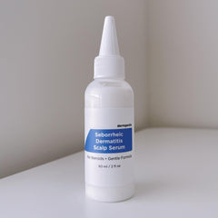 Dermgentle Seborrheic Scalp Serum bottle pour enables quick, targeted scalp care.