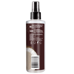 Desert Essence coconut hair defrizzer spray shown delivering frizz-free results.