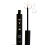 DIME Beauty eyelash boost serum bottle close-up for healthy lash nourishment.