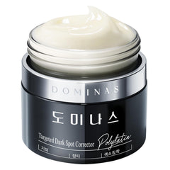 DOMINAS Dark Spot Corrector Cream bottle front showing brightening formula for even skin tone.