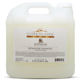 Dominican Magic Detangler Shampoo Coconut Infused bottle highlights compact design for on-the-go hydration