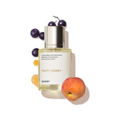Dossier Fruity Honey bottle close-up highlighting nectarine and blackcurrant notes for daily wear.