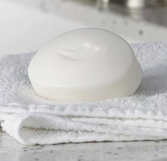 12-pack Dove travel-size soaps arranged for easy packing during trips.
