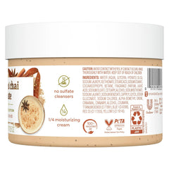 Close-up of exfoliating particles in Dove Spiced Chai Latte scrub for gentle buffing.