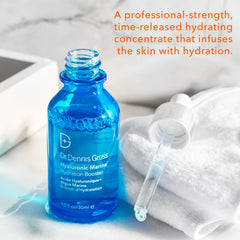 Dr Dennis Gross Hyaluronic Marine Hydration Booster applying to cheeks for smooth look.