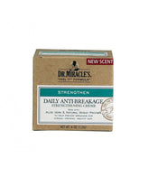 Dr. Miracle's Strengthen Daily Creme bottle close-up highlighting anti-breakage formula for hair and scalp care.