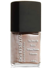 Dr.'s Remedy Poised Pink Champagne nail polish bottle shows rich, toxin-free color.