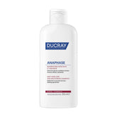 Ducray Anaphase+ strengthening shampoo bottle on a bathroom shelf for daily thinning hair care.