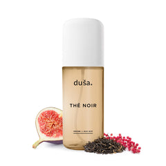 DUSA Thé Noir hair perfume bottle with rich tea notes and elegant glow.