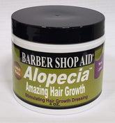 D WRIGHT ALOPECIA biotin bottle closeup showing a nourishing scalp care formula.