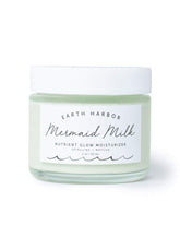 Earth Harbor Mermaid Milk bottle closeup highlighting a lightweight, hydrating formula