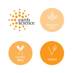 Earth Science fragrance-free almond-aloe moisturizer label closeup shows vegan and paraben-free