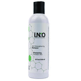 Earthly Body Inside Out Shampoo bottle closeup shows color-safe formula for all hair types.