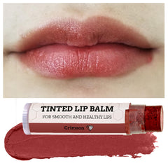 Applying Earth's Daughter Crimson tinted lip balm as a base for gloss