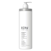 ECRU New York Rejuvenating Shampoo bottle close-up showing hydrating formula for refreshed hair.