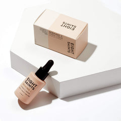Eight Saints Vitamin C Serum dropper closeup highlighting fast-absorbing Vitamin C.