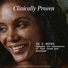 Gently applying Elemis Pro-Collagen Night Cream to the neck and décolletage.