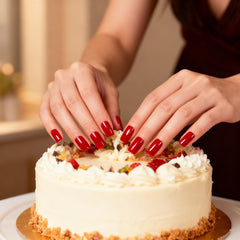 Close-up of ELEVENAIL glossy red nails showing a flawless finish.