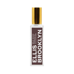 Ellis Brooklyn Milk Wood perfume oil roll-on bottle closeup, highlighting creamy fragrance notes