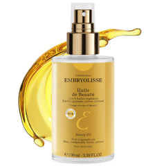 Embryolisse Beauty Oil on the face for nourished, radiant skin.