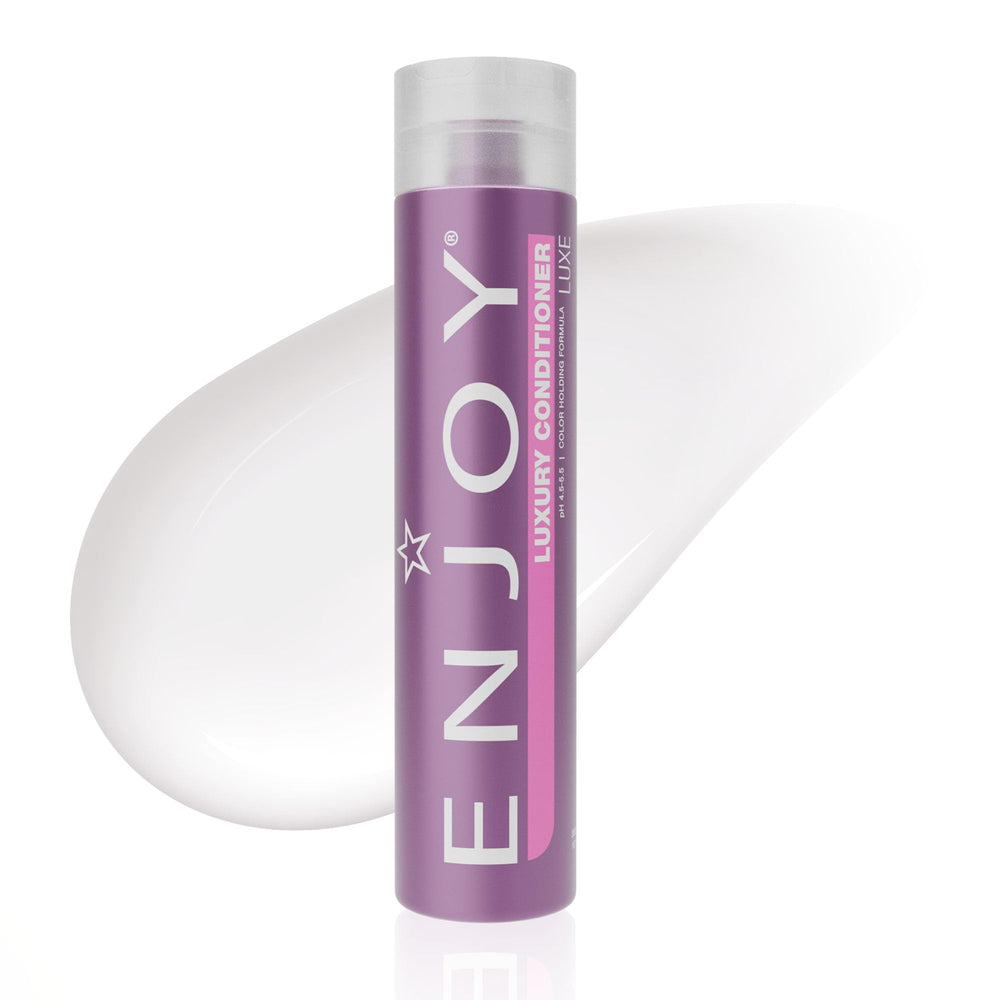 Enjoy Luxury Conditioner bottle being poured for smooth frizz control and hydration