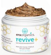 Era Organics Manuka Honey Exfoliating Face Scrub bottle closeup, moisturizing microdermabrasion for glowing skin.