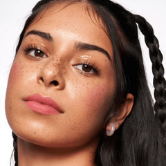 essence Magic Filter Glow Booster liquid texture brightens skin with a sheer glow.