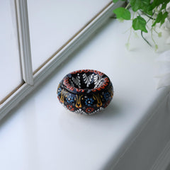 EVANILIFE handcrafted-patterns ceramic jar showcases vibrant motifs for stylish shelves.