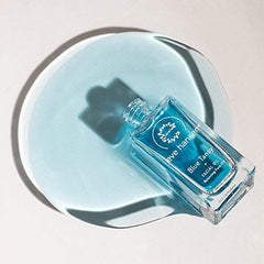 Eve Hansen Blue Tansy facial oil dropper close-up for daily nourishment.