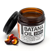 Fadelo Batana oil bottle on wood for natural hair nourishment and shine
