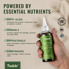 Fadelo Batana Oil hands applying oil to scalp for nourishment.