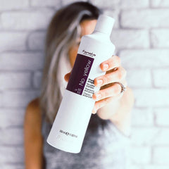 Fanola No Yellow Shampoo lathering on hair to reduce yellow tones